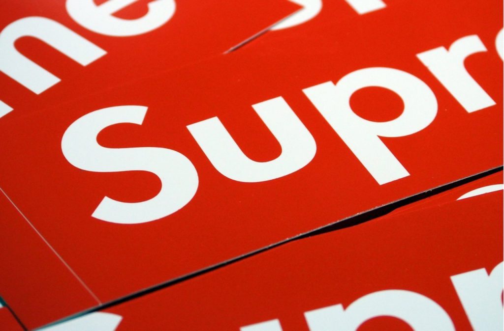 Classic red and white supreme logo on stickers