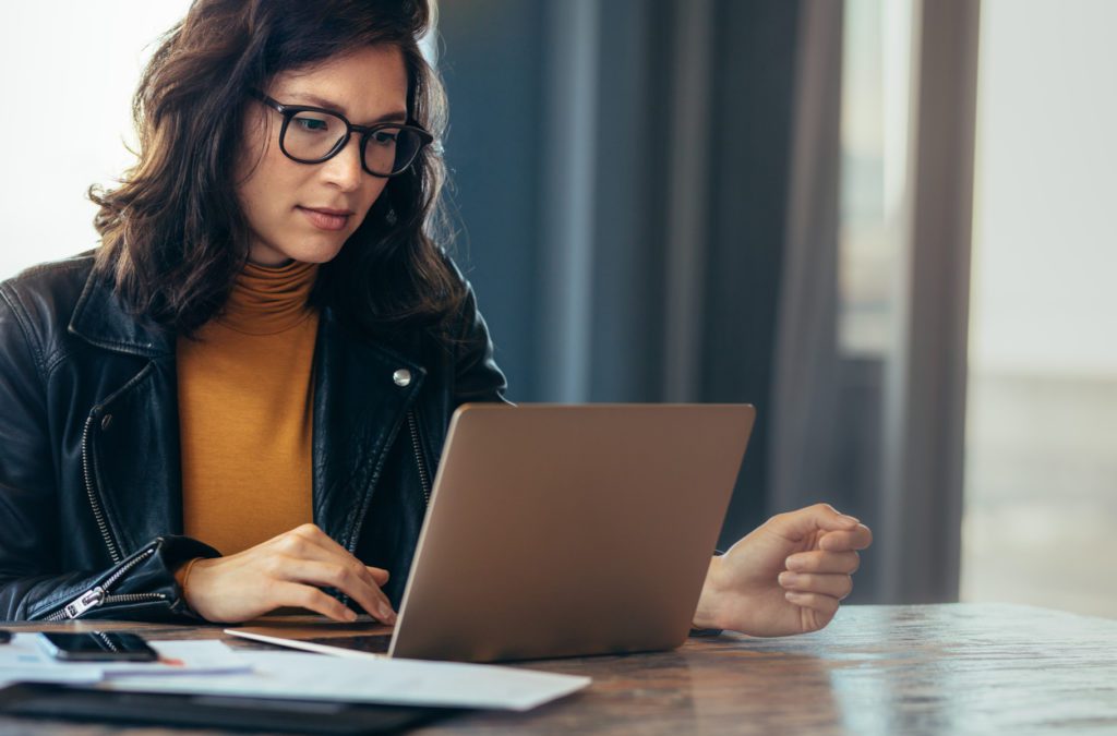 Busy business woman working on laptop